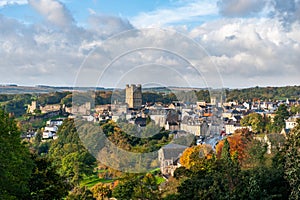 View of Richmond Castle, North Yorkshire with the town in the foreground and autumn colours