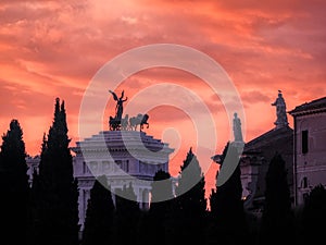 View of riders on Vittoriano at sunset, Rome, Italy