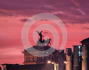 View of riders on Vittoriano at sunset, Rome, Italy