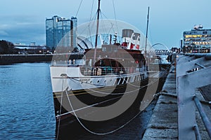 View on the river Clyde and the old steamer on the dock in the evening