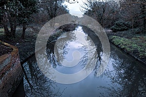 View of river Crane in Cranford park on a gloomy day