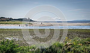 A view river doon estuary with canoeists and a photographer photo