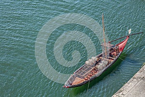 View of river Douro, with a Rabelo Boat with barrels of Port wine