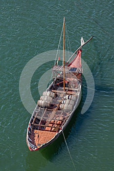 View of river Douro, with a Rabelo Boat with barrels of Port wine