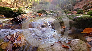 View of the river flowing from the mountain waterfall.