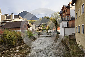 View of the river flowing through the town of Bad Aussee. Autumn alpine landscape. Bad Aussee, Austria