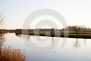 View on river, the natural landscape and its water reflection in fresenburg emsland germany