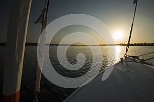 View of river nile in Egypt from sailing boat at sunset