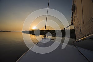 View of river nile in Egypt from sailing boat at sunset