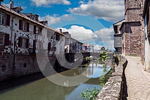 View of the river Nive on its way through the village of Saint Jean Pied de Port. France