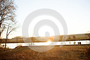View on a river and the plants with sun light at a lost place in fresenburg emsland germany
