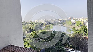 View of the River, with sideline of railway and the buildings covered with green trees