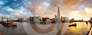 View of River Thames and City Skyline during dramatic sunset. City of London, United Kingdom