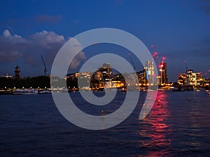 View of the River Thames with Lambeth Bridge and the architectural buildings of the south bank at night.