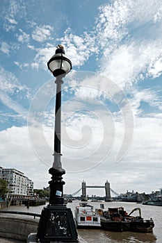 View of the River Thames and Tower Bridge seen from Grant`s Quay Wharf, London, UK.