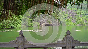 View on a river which flows among limestone muntains in Ninh Binh, a tourist destination in northern Vietnam. Travel to