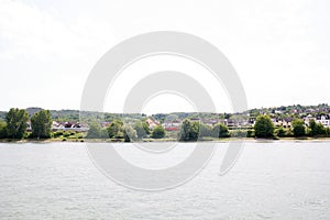 View on the riverbank under blue sky at the rhine river