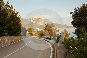 View of the road, the Black sea and Ilyas-Kaya mountain on the southern coast of Crimea. photo