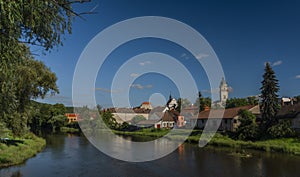 View from road bridge over Jihlava river in Dolni Kounice village in summer day