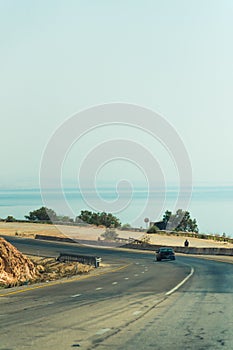 view of the road and the Dead Sea in the background