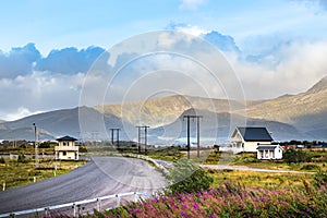 View from a road with mountains and wooden houses, Leknes, Norway photo