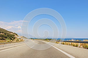 View of the road on a sea shore in Greece