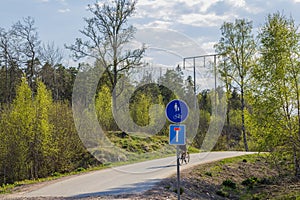 View of road signs for pedestrians and bicycles and warning for dead end road