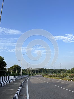 The view of road under the clear blue sky
