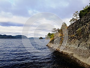 View of a rock cliff on Farris Lake in Larvik, Norway