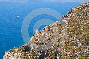 View on rock coastline and ocean from hiking trail on Greek island Telendos.