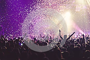 View of rock concert show in big concert hall, with crowd and stage lights, a crowded concert hall with scene lights, rock show pe