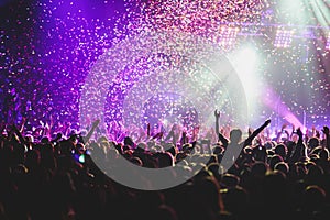 View of rock concert show in big concert hall, with crowd and stage lights, a crowded concert hall with scene lights, rock show pe