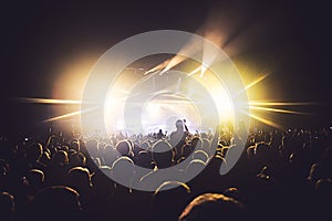 View of rock concert show in big concert hall, with crowd and stage lights, a crowded concert hall with scene lights, rock show pe