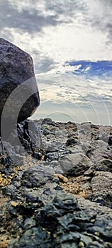 the view of the rock in the evening when the sea water recedes photo