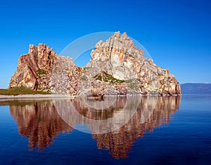 View of a rock on the Lake Baikal in the early sunny summer morning
