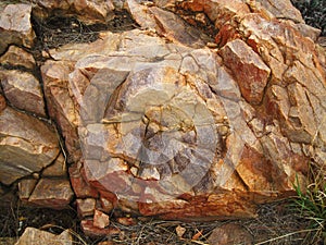 ROCK SURFACE WITH MULTIPLE COLOURS AND SURFACES photo