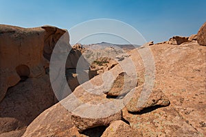 View from rock to stones and mountains on the horizon