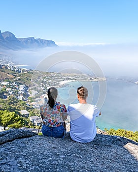 view from The Rock viewpoint in Cape Town over Campsbay, view over Camps Bay with fog over the ocean