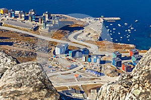 View from the rocks to the Nuuk city with modern buildings and
