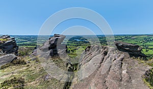 A view from the rocky cliff edge on the summit of the Roaches escarpment, Staffordshire, UK