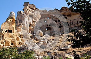 View of a rocky mountain with holes in the town of Ãavu?in, Cappadocia, Turkey