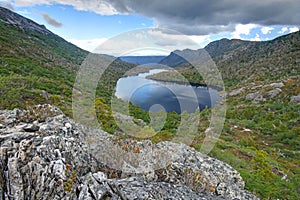 a view of a rocky mountain and lake in tasmania