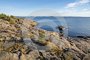 View of the rocky shore of Puistovuori and sea