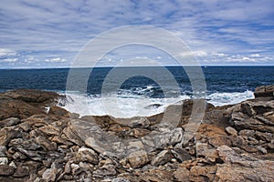 The view of rocky shore, surf and sea at Point Ellen in Vivonne Bay on Kangaroo Island, Australia.