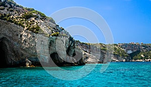 View on rocky shore of Zakynthos Island and crystal clear water of Ionian Sea