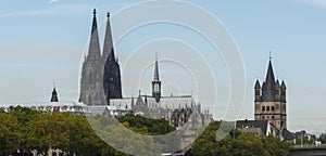 View of the Roman Catholic Gothic Cathedral Kolner Dom and the Romanesque Catholic church `Gross Sankt Martin`