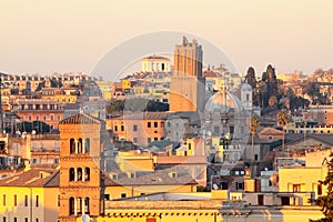 View of Rome roofs: Palazzo Senatorio`s Tower, San Giorgio in Velabro Basilica`s Towerbell, San Luca and Martina`s Church Dome photo