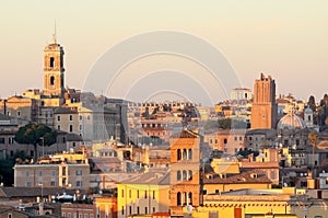 View of Rome roofs: Palazzo Senatorio`s Tower, San Giorgio in Velabro Basilica`s Towerbell, San Luca and Martina`s Church Dome photo