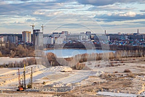 View from the roof to the wasteland - the site of future construction, a reservoir and modern houses