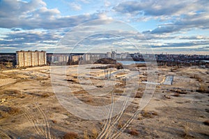 View from the roof to the wasteland - the site of future construction, a reservoir and modern houses